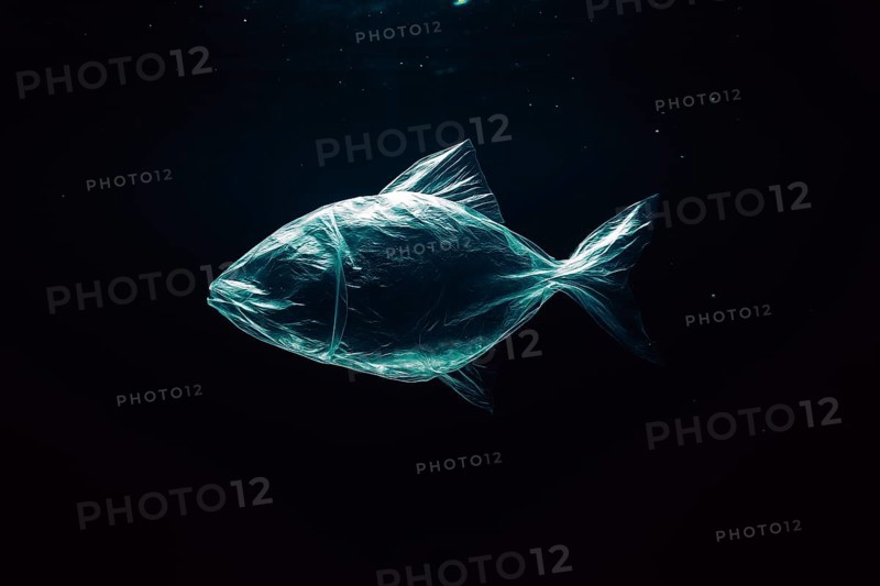 Plastic bag in the shape of a fish, realistically floating in the open ocean, with air bubbles, dark dramatic lighting mood from above, symbolic image for environmental pollution caused by plastic in the sea, AI-generated, AI-generated, AI generated