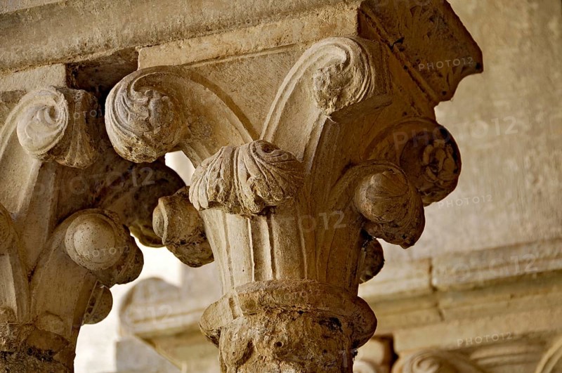 Slender Gothic columns with filigree capitals in the cloister, Gothic basilica of the Cistercian Abbey of Fossanova, Cistercian-Burgundian architectural style, Priverno, Province of Latina, Lazio, Italy