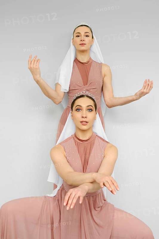 Two female dancers repeat the choreography