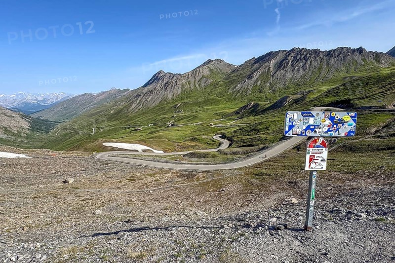 Panoramic view of northern ramp northern ascent mountain road alpine road to pass in Alps high Alps alpine pass above tree line, right sign pass marking of 2744 metre high Col d'Agnel, Colle dell'Agnello, ontgillarde, Molines-en-Queyras, Hautes-Alpes, France