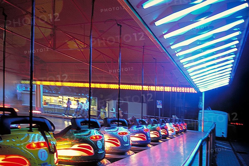 Illuminated bumper cars at night, New Jersey, USA
