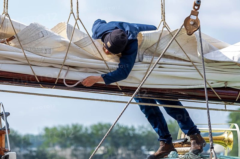 Sailor attaches sail, sailing ship, Kieler Woche, Holtenau, Kiel, Schleswig-Holstein, Germany