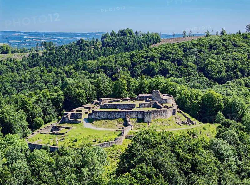 The Falkenburg ruins in the Teutoburg Forest are a castle ruin near the village of Berlebeck in the Detmold district. The former hilltop castle was built from around 1190. Aerial view. Berlebeck, North Rhine-Westphalia, Germany
