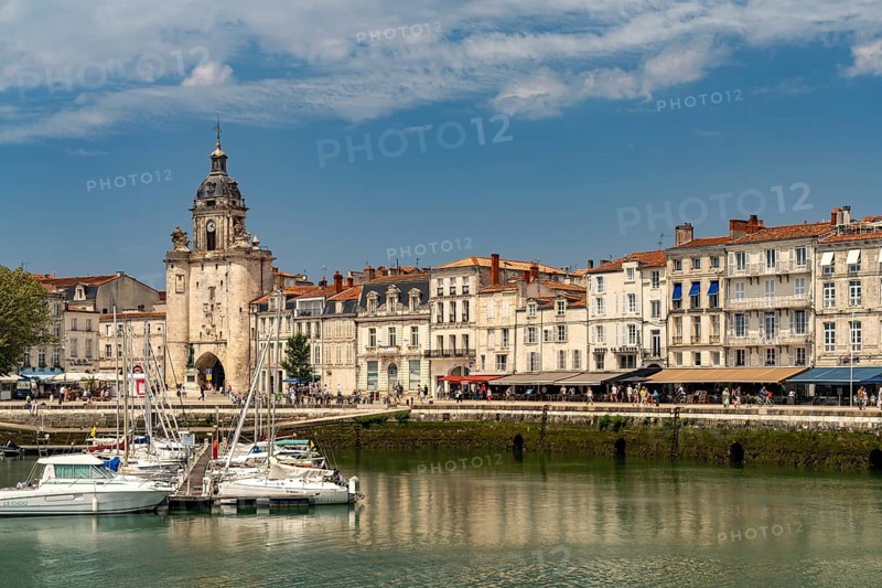 Harbour, Porte de la Grosse Horloge clock tower and the old town in La Rochelle, France