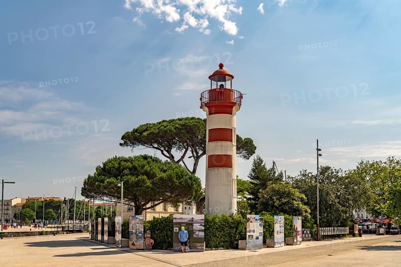 The old red lighthouse Phare Rouge at the harbour in La Rochelle, France