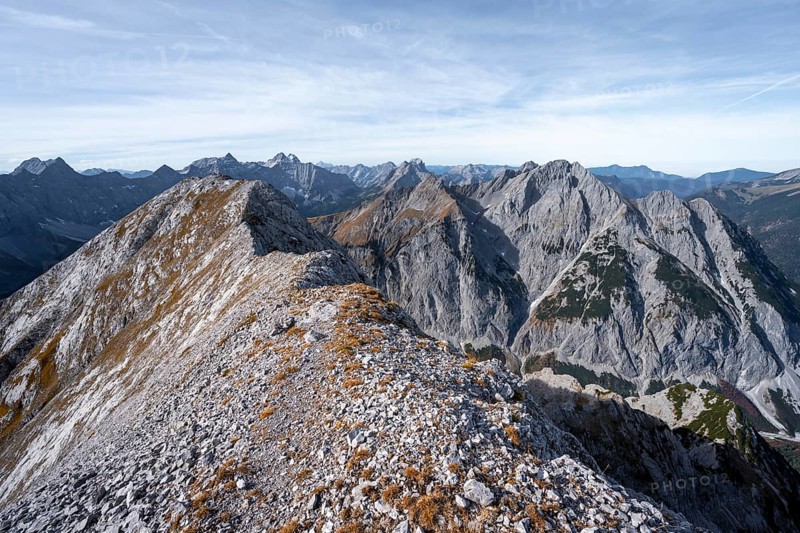 Mountain panorama, ridge of the Gamsjoch, transition to the main summit of the Gamsjoch, behind western summit with summit cross, behind mountain ridge of the Hinterautal-Vomper chain, in autumn, RiÃŸtal in the Eng, Karwendel, Tyrol, Austria