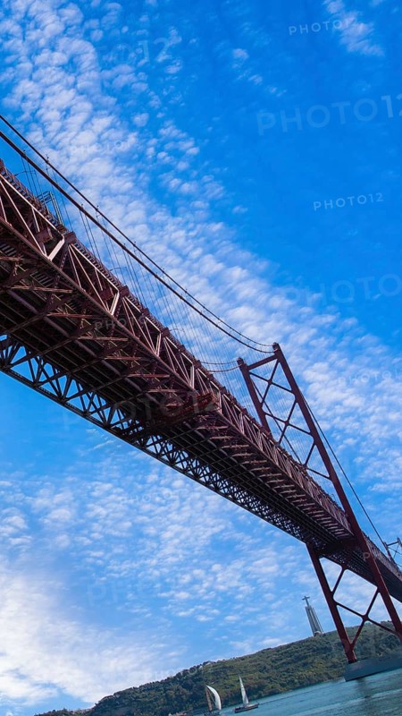 Lisbon, Landmark suspension 25 of April bridge over Tagus reiver near Belem tower