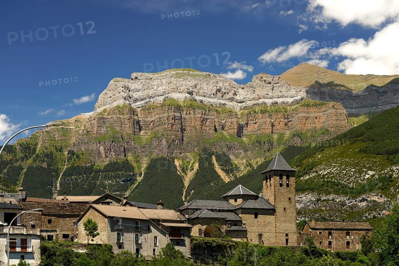 The Iglesia de San Salvador church in Torla and the Monte Perdido massif in Torla-Ordesa, Spain