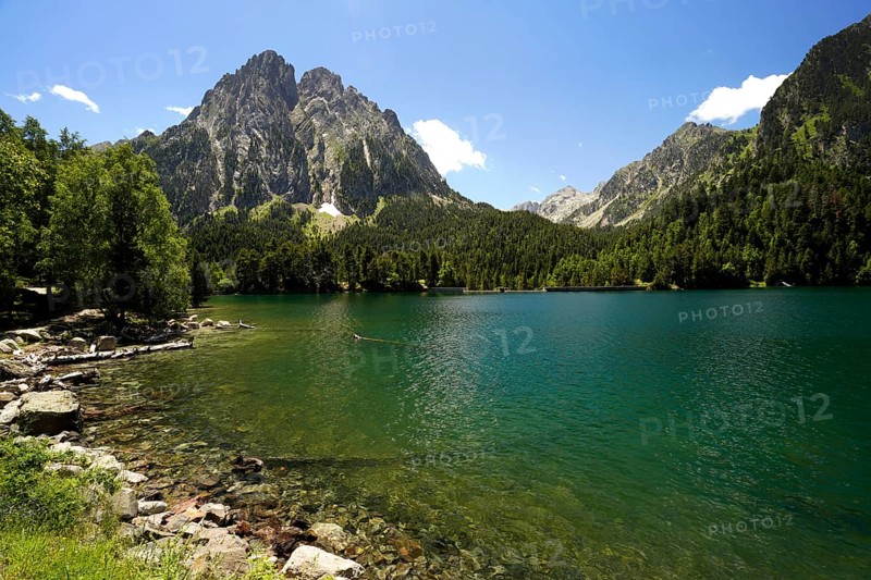 The Estany de Sant Maurici lake and the Els Encantats mountain range in the AigÃ¼estortes i Estany de Sant Maurici National Park, Catalonia, Spain