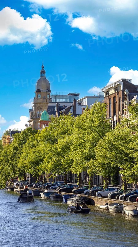 Holland, Amsterdam canals with scenic bridges and historic city center, UNESCO World Heritage site