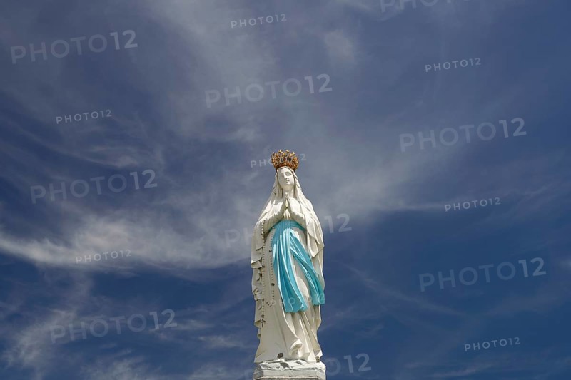 Statue of the Crowned Madonna of Our Lady in Lourdes on Rosary Square in the Marian pilgrimage town of Lourdes, Pyrenees, France