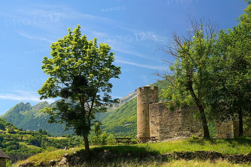 The ruins of the ChÃ¢teau Sainte-Marie castle in Esterre and the mountain landscape near Luz-Saint-Sauveur, Pyrenees, France