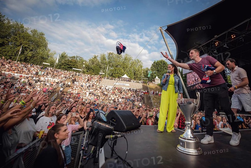 EisbÃ¤ren Berlin players throw scarves and other fan merchandise into the audience at the Berliner Rundfunk 91.4 Open Air at the Berlin ParkbÃ¼hne Wuhlheide on 5 July 2025
