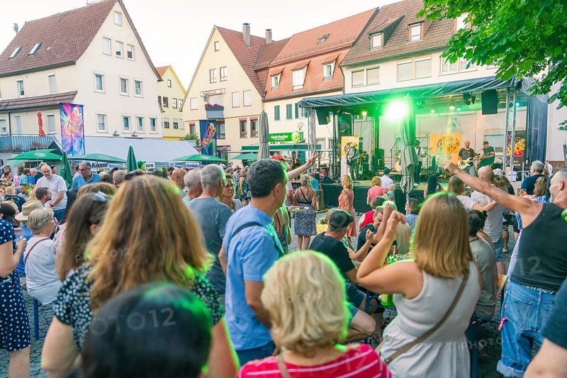 Lively scene of a summer concert with people dancing outdoors, 950th anniversary of Weil der Stadt, Böblingen district, Germany