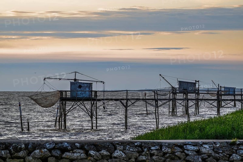 Sunset over Fishing huts over Randonnee entre Histoire et Nature, Fouras, Fouras-les-Bains, Charente-Maritime, Nouvelle-Aquitaine, France