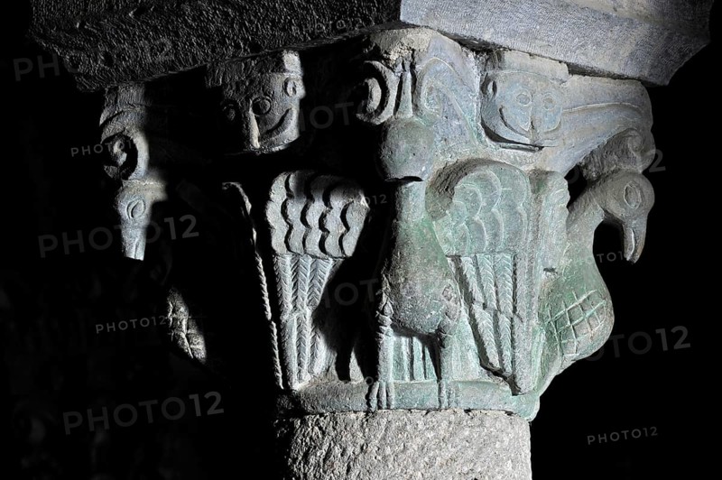 Column capital with dove, relief in stone, underground grove of columns, pagan crypt, 10th century, gloomy illumination, Cathedral of Acquapendente, Basilica of the Holy Sepulchre, Basilica Santo Sepolcro, Basilica minor, Aquapendente, Province of Viterbo, Lazio, Italy