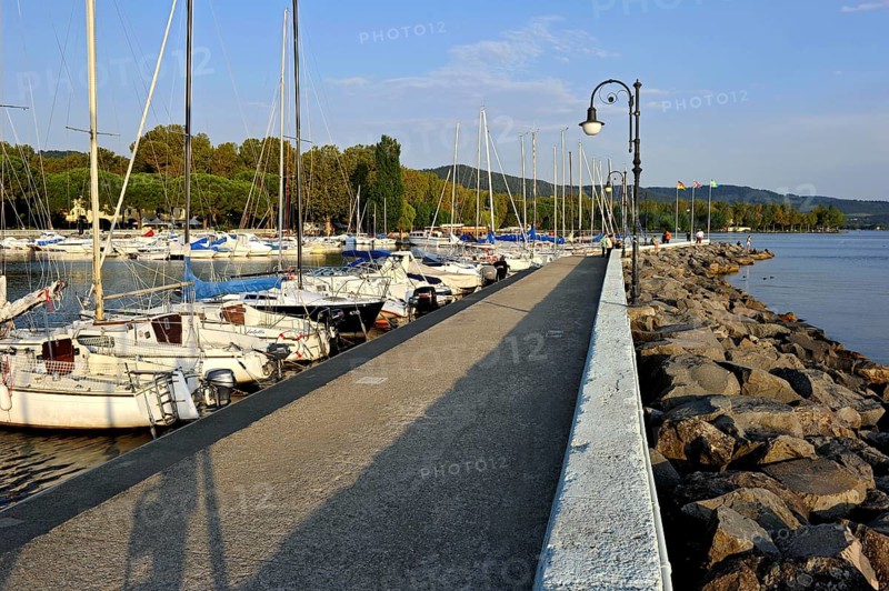 Quay with breakwater made of boulders, Bolsena marina, Porto Turistico di Bolsena, Lake Bolsena, Lago di Bolsena, volcanic crater lake, Bolsena, Province of Viterbo, Lazio, Italy