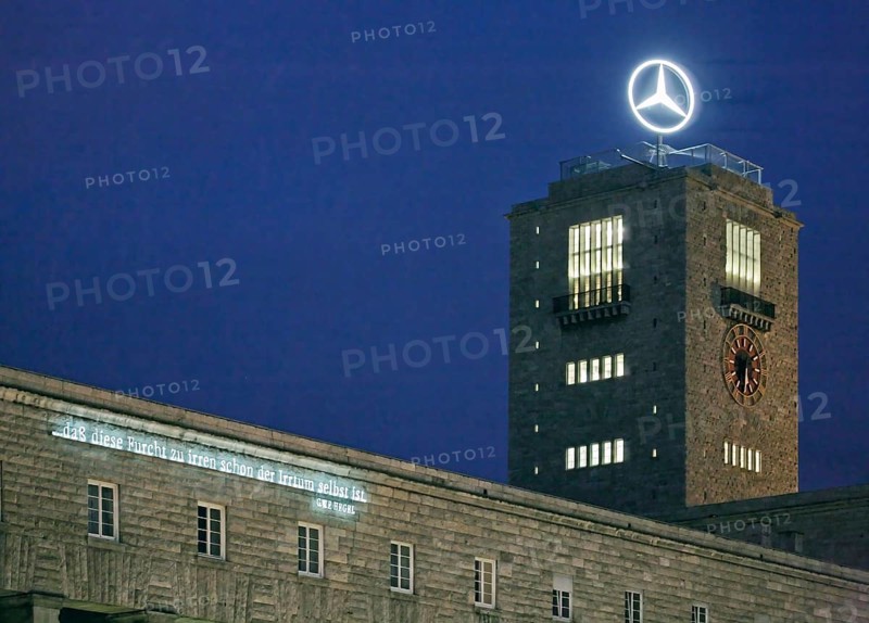 Stuttgart Central Station in front of the start of the Stuttgart 21 project. With investments totalling several billion euros, the construction work is intended to turn the old station into a modern through station. A quote from Georg Wilhelm Friedich Hegel is illuminated on the Bonatzbau: ... THAT THIS FEAR OF IRRENCE IS IRRENCE ITSELF. Stuttgart, Baden-WÃ¼rttemberg, Germany
