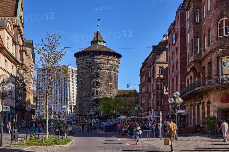 Frauentorturm, city fortification, round tower, pedestrian zone, historical buildings, modern architecture, lantern, trees, street, pedestrians as secondary motif, blue sky, cloudless, intersection KönigstraÃŸe with LuitpoldstraÃŸe, Nuremberg, Middle Franconia, independent city, Bavaria, Germany