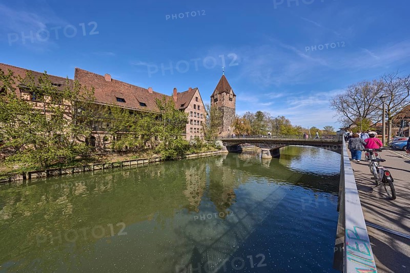 Schuldturm, river Pegnitz, bridge, historical buildings, house, trees, reflections, water surface, street, metal railing, pedestrian as secondary subject, super wide angle, blue sky, cirrostratus clouds, Unterer Bergauer Platz, HeubrÃ¼cke, Vordere Insel SchÃ¼tt, Nuremberg, Middle Franconia, independent city, Bavaria, Germany