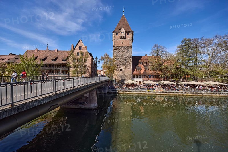 Schuldturm, river Pegnitz, car bridge and pedestrian bridge, historic buildings, metal railings, trees, outdoor area, Cafe and Bar Celona, reflections, water surface, pedestrians as secondary motif, blue sky, cirrostratus clouds, HeubrÃ¼cke, Vordere Insel SchÃ¼tt, Nuremberg, Middle Franconia, independent city, Bavaria, Germany