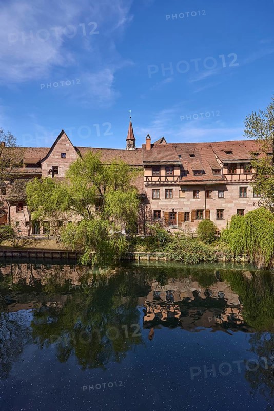 River Pegnitz, historic buildings, Babylon willow (Salix babylonica), trees, reflections, water surface, blue sky, cirrostratus clouds, Vordere Insel SchÃ¼tt, Nuremberg, Middle Franconia, independent city, Bavaria, Germany