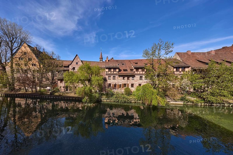River Pegnitz, historical buildings, trees, symmetrical reflections, water surface, blue sky, cirrostratus clouds, Vordere Insel SchÃ¼tt, Nuremberg, Middle Franconia, independent city, Bavaria, Germany