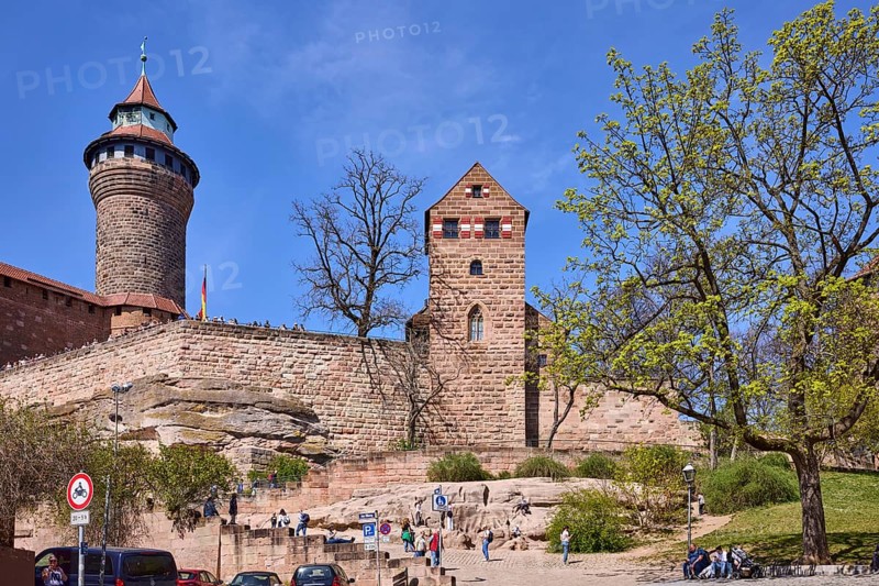 Imperial Castle, St. Walburgis Castle Chapel, Sinnwell Tower, monkey rock, castle, round tower, castle chapel, castle wall, trees, lawn, pedestrians as secondary motif, blue sky, cirrostratus clouds, BurgstraÃŸe, Nuremberg, Middle Franconia, independent city, Bavaria, Germany