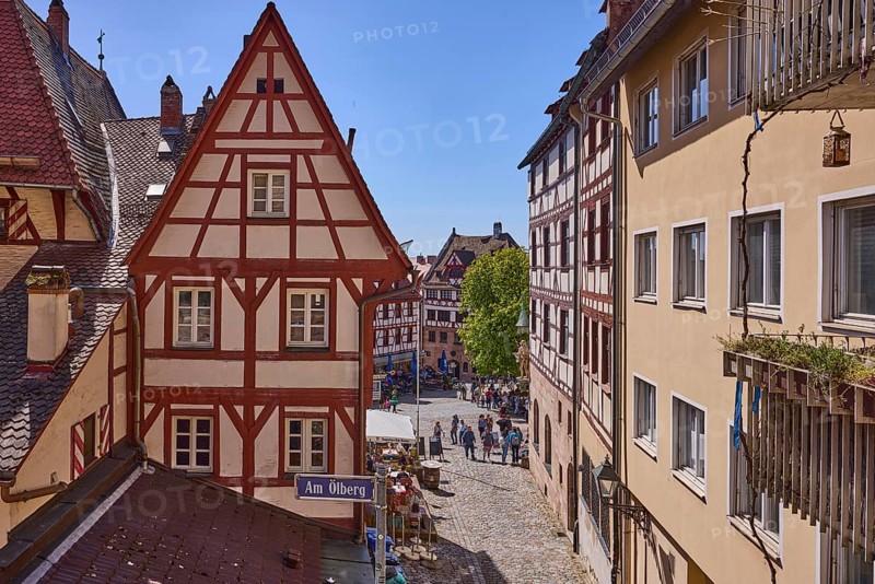 Historic half-timbered houses, residential buildings, gables, pointed roofs, faÃ§ade, window, balcony, backlight, blue sky, cirrostratus clouds, Am Ã–lberg, Beim TiergÃ¤rtnertor, Obere Schmiedgasse, Nuremberg, Middle Franconia, independent city, Bavaria, Germany