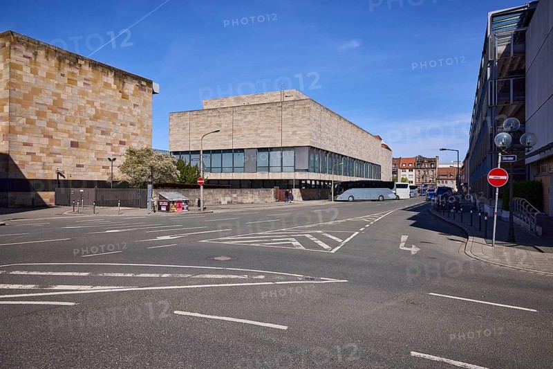 Germanisches National Museum, cultural history museum, modern architecture, building, parking boxes, coach, lantern, roadway, lane markings direction arrow, restricted area, blue sky, cirrostratus clouds, intersection Grasersgasse with Frauentor wall, Nuremberg, Middle Franconia, independent city, Bavaria, Germany
