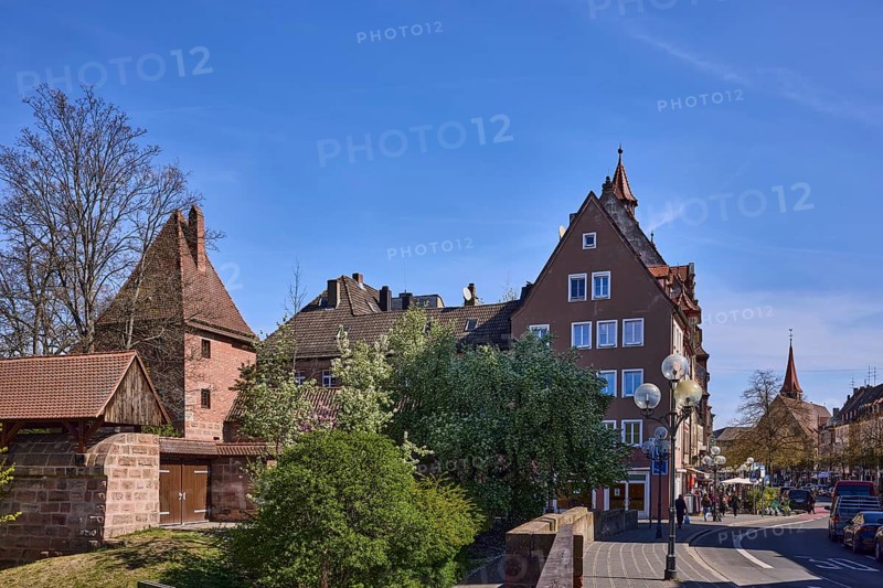 Old town, city fortification, city wall, defence defence tower, trees, historical buildings, lantern, blue sky, cirrostratus clouds, crossing Ludwigstor with Spittlertor wall and LudwigstraÃŸe, Nuremberg, Middle Franconia, independent city, Bavaria, Germany