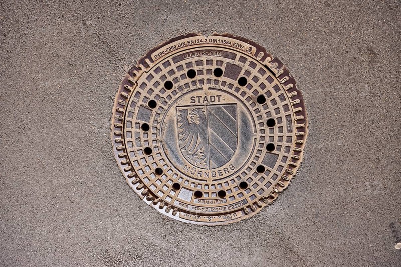 Manhole cover, city coat of arms, drainage, asphalt, road, Nuremberg, Middle Franconia, independent city, Bavaria, Germany