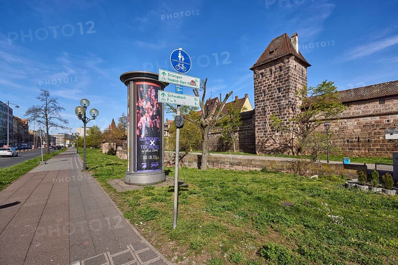 Footpath and cycle path, traffic sign shared footpath and cycle path, advertising pillar, lantern, trees, meadow, city fortification, city wall, defence defence tower, blue sky, cirrostratus clouds, Frauentor wall, Frauentor moat, Nuremberg, Middle Franconia, independent city, Bavaria, Germany