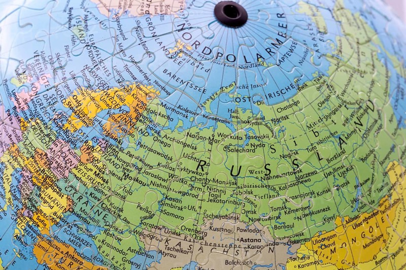 Puzzle globe. Map made from puzzle pieces. Russia and North Pole