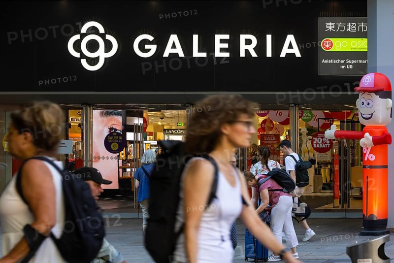 Galeria Kaufhof. Logo and entrance of the department stores' with people in Stuttgart, Baden-WÃ¼rttemberg, Germany