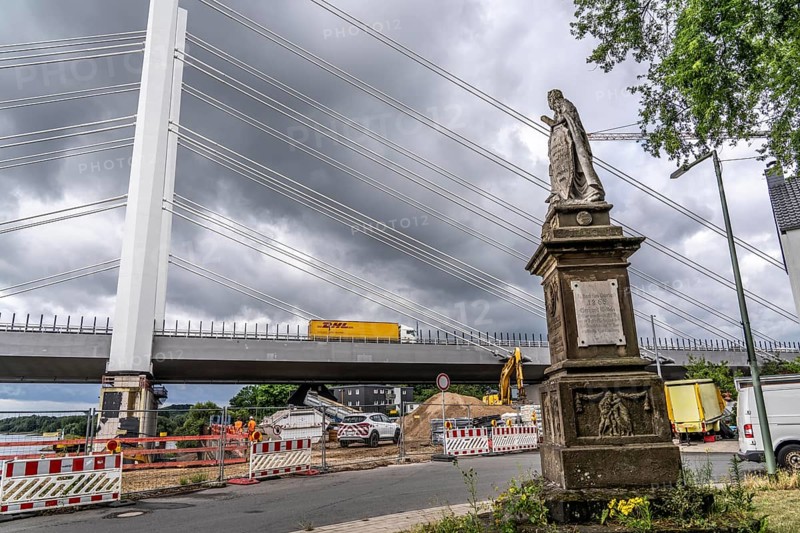 New construction of the motorway bridge Neuenkamp of the A40, over the Rhine near Duisburg, the first bridge is standing, construction of the second bridge, Germania monument on Wilhelmallee North Rhine-Westphalia, Germany