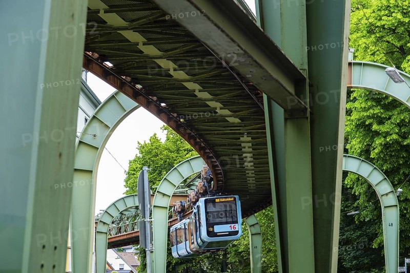The Wuppertal suspension railway runs through Vohwinkel in front of buildings from the Wilhelminian era near the Hammerstein stop in Wuppertal, Germany