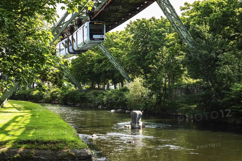 A suspension railway at the crash site of Tuffi the elephant. A sculpture of an elephant stands in the Wupper to commemorate the event, Wuppertal, Germany