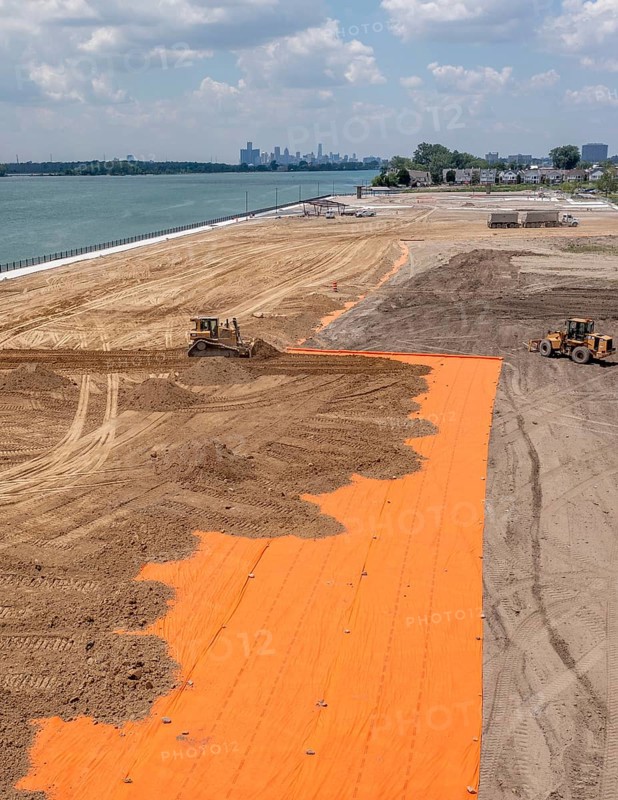 Detroit, Michigan - Workers spread clean dirt after old industrial contamination of cadmium, arsenic, lead, and other metals was removed from A.B. Ford Park on the Detroit River