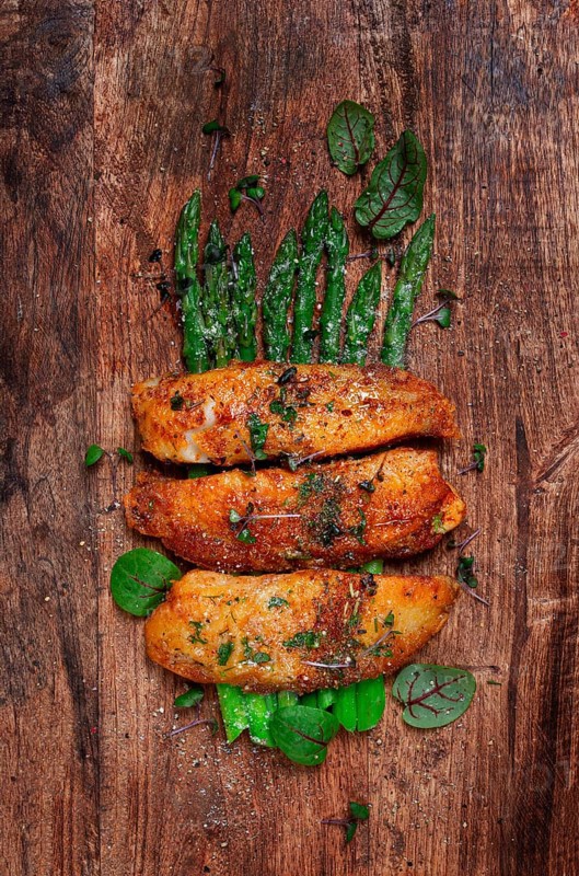 Fried fish fillet, tilapia with asparagus, homemade, no people