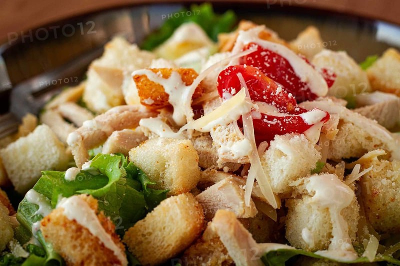 Classic Caesar salad, close-up, natural light, selective focus, horizontal