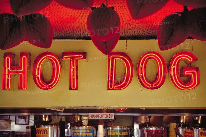 Illuminated advertising at a hot dog stand, New York City, USA