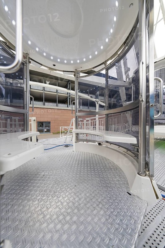 Interior view of a giant wheel cabin with metallic surfaces and modern design, fire brigade exercise for gondola rescue, Germany