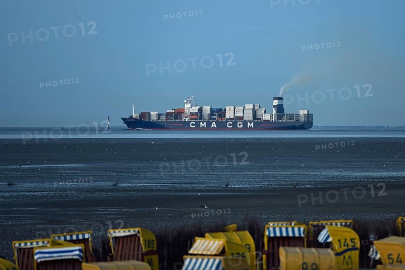 Large container ship... Elbe fairway through the Wadden Sea off Cuxhaven, North Sea, view from Duhnen, Elbe estuary, Lower Saxony, Germany