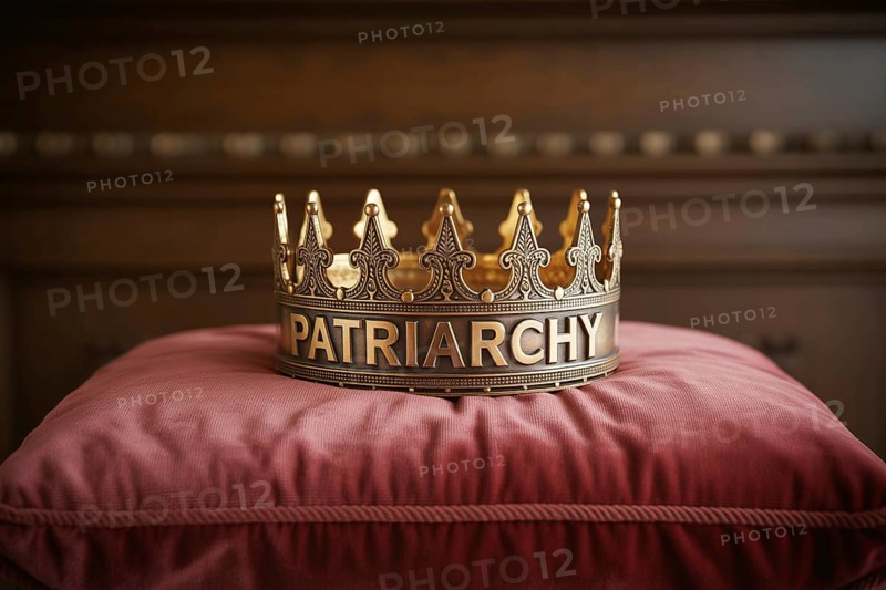 Golden crown with the word Patriarchy resting on a red cushion. Symbol of power and societal patriarchy. Generative Ai, AI generated