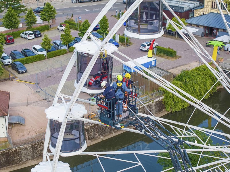 Fire brigade uses platform for rescue on Ferris wheel, Fire brigade exercise for gondola rescue, Germany