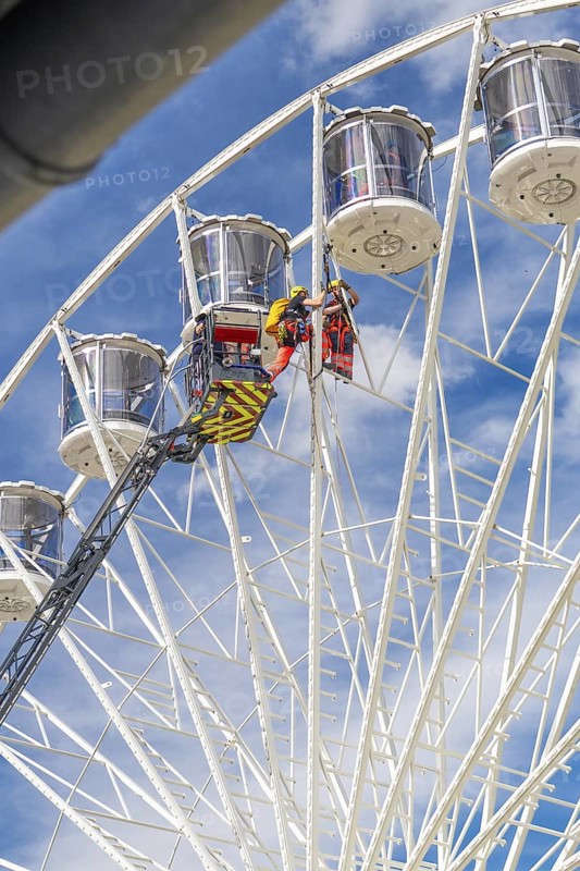 Rescue operation on a Ferris wheel, firefighters at height, fire brigade exercise for gondola rescue Ferris wheel, Calw, Germany