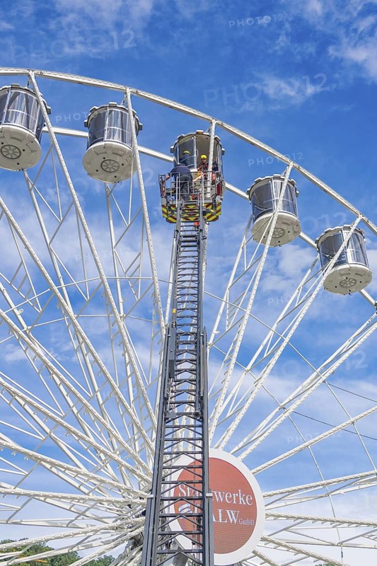Emergency crew on lifting platform on the Ferris wheel near the gondolas, fire brigade exercise for gondola rescue on the Ferris wheel, Calw, Germany