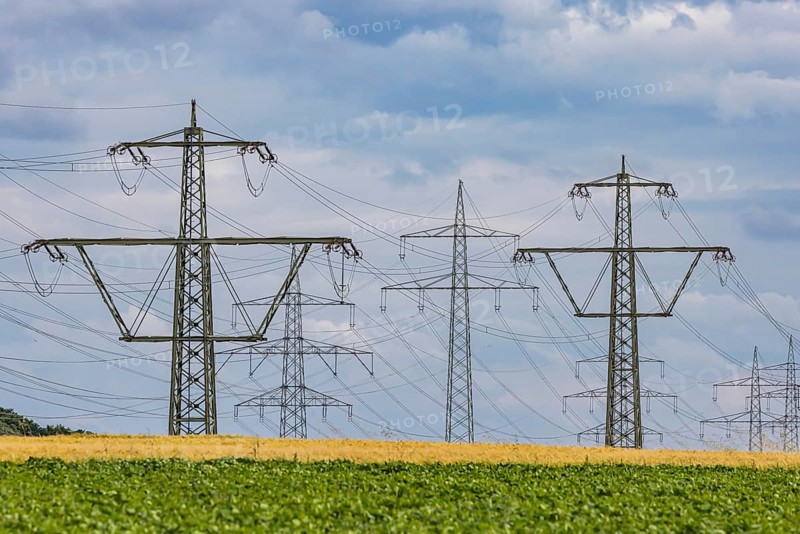 Many high-voltage power lines and lattice towers in the district of Ludwigsburg near Besigheim, Baden-WÃ¼rttemberg, Germany