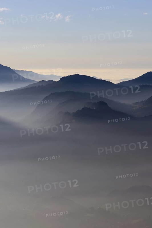 Mountain silhouettes... Alpine peaks and mountain ranges in the Bavarian Alps, light fog rises from the valleys, which creates an idyllic atmosphere in the light of the low sun, romantic view from Oberstdorf towards Kleinwalsertal, local nature, Bavaria, AllgÃ¤u, AllgÃ¤u Alps, Bavarian, Germany, Western Europe